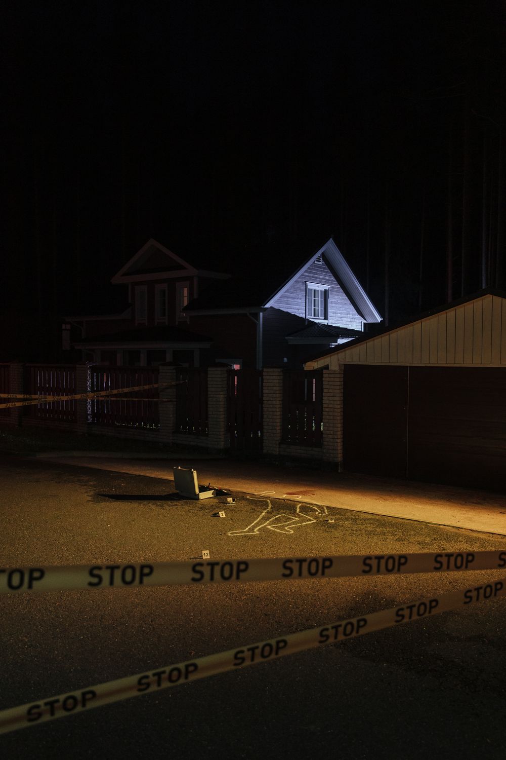 Violent Crime Is Falling Across America, But Many Families Still Do Not Feel Safe 1 A suburban crime scene at night with chalk outline and police line tape.
