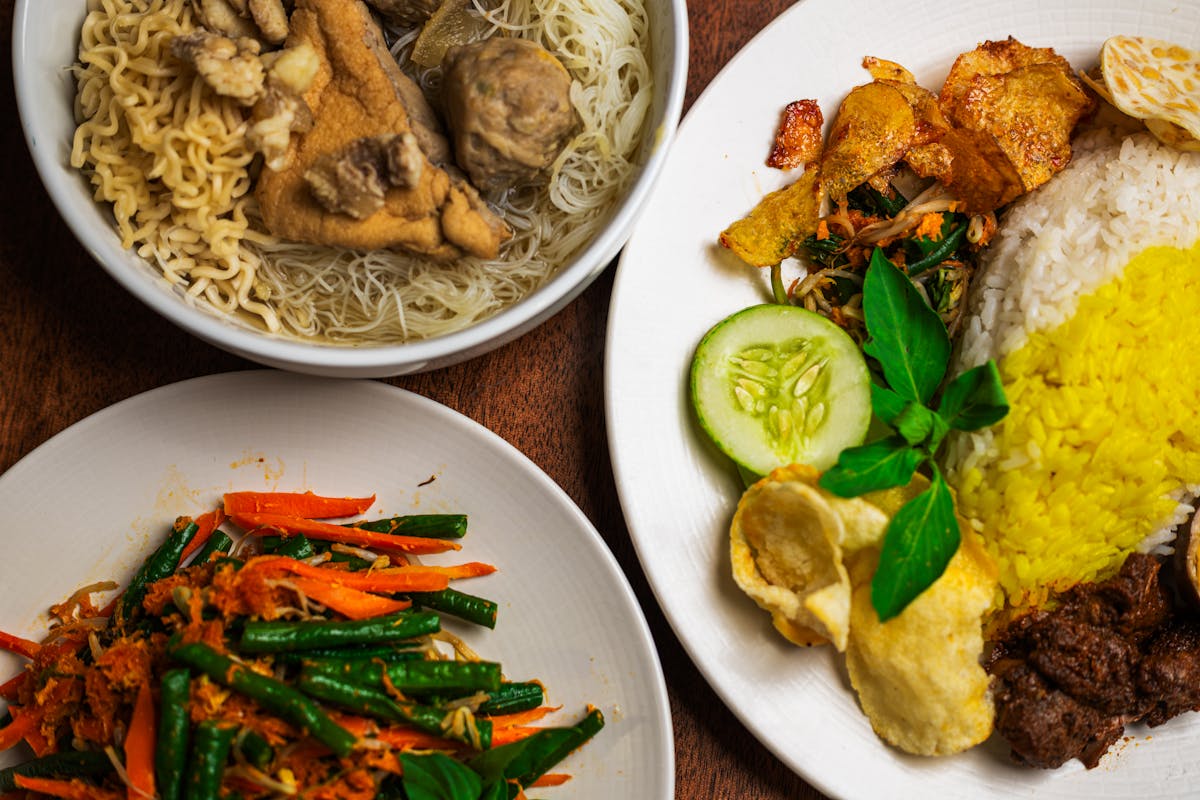 A vibrant array of traditional Indonesian dishes showcasing local flavors and ingredients.