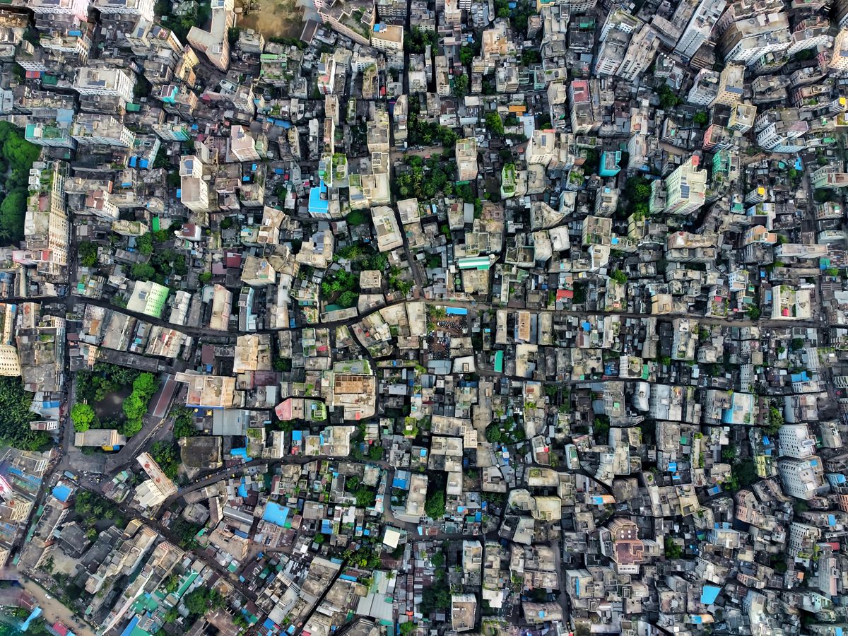Aerial shot of a densely packed urban cityscape highlighting architecture and city planning.