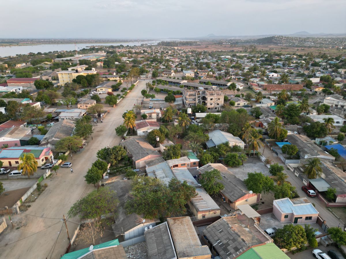 8 World’s Most Corrupt Nations Right Now 1 Aerial shot of a peaceful residential neighborhood with greenery in the afternoon light.