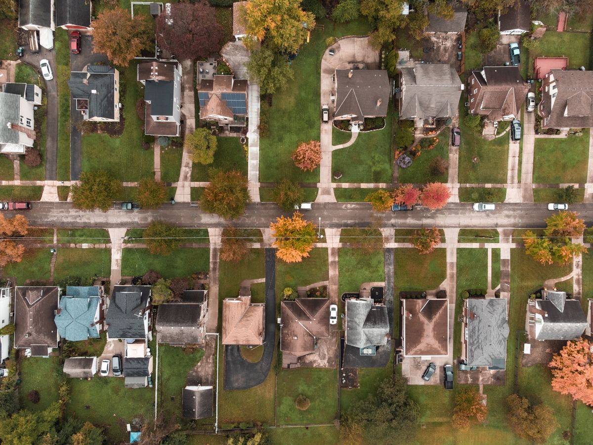 Aerial view of a suburban neighborhood in Ohio showcasing fall foliage and residential houses.