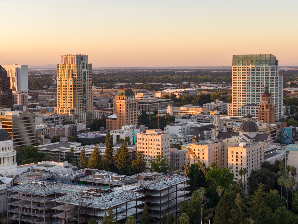 These Are the Fastest-Growing Cities in America but Residents Say Growth Is Getting Uncomfortable 1 Aerial view of Sacramento skyline during sunset with the Tower Bridge and cityscape in focus.