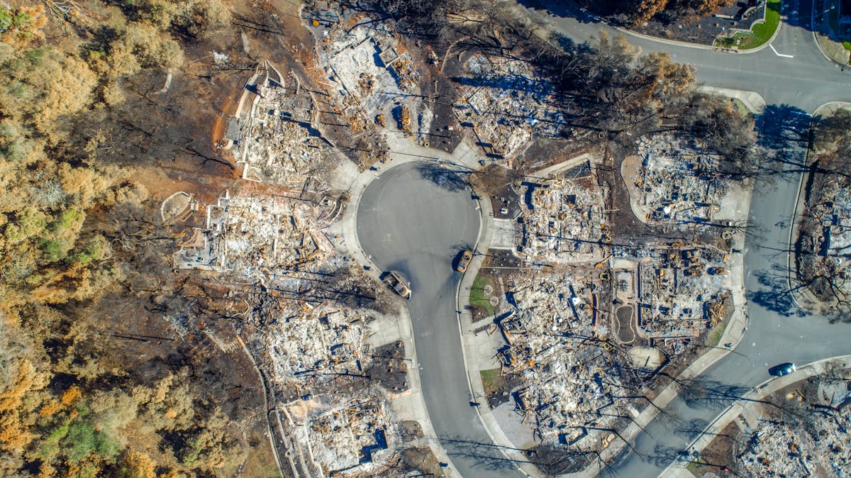 10 California Regions Where Wildfire Smoke Can Turn Dangerous Fast 4 Aerial view of Santa Rosa neighborhood devastated by Tubbs Fire. Burned homes visible.