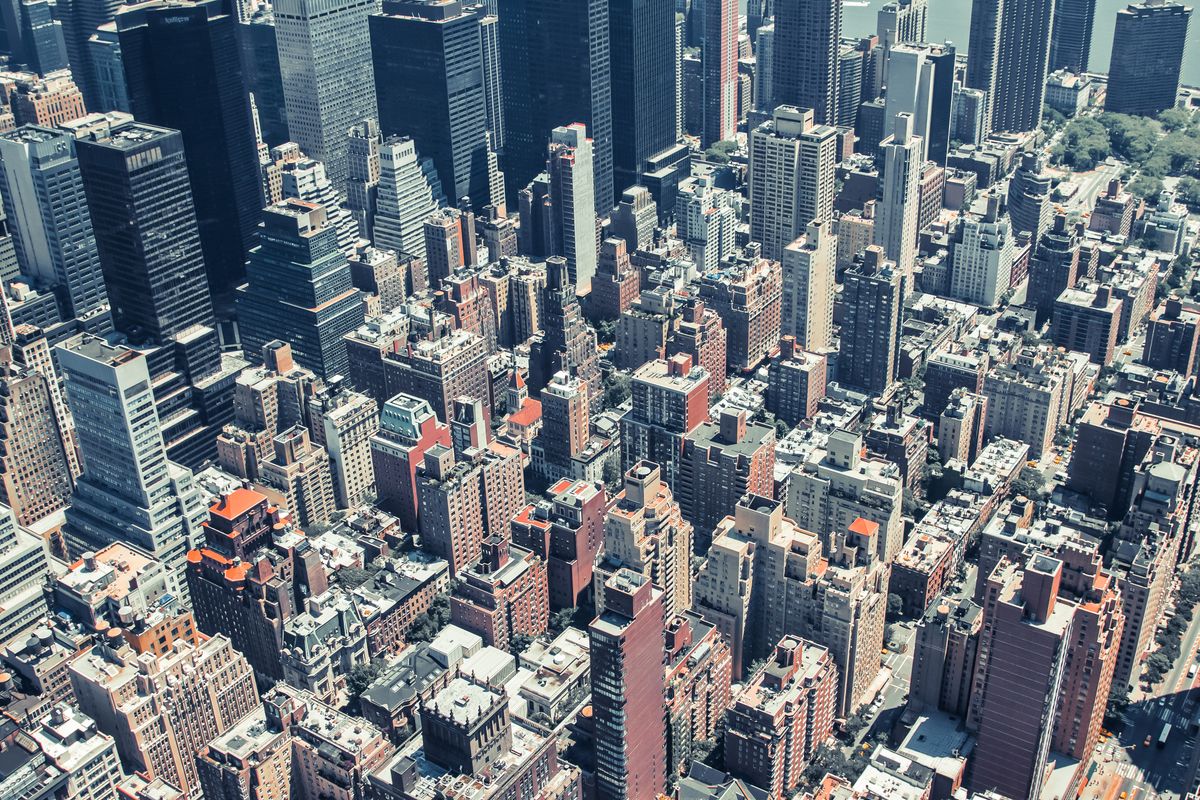 Aerial view showcasing the dense urban landscape of New York City skyscrapers.