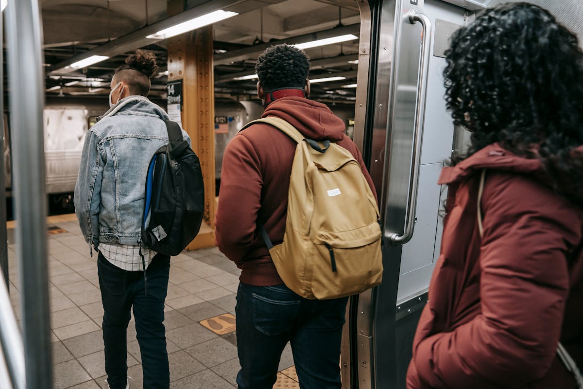11 Everyday Things That Drive New Yorkers Absolutely Crazy 3 Back view of anonymous young multiracial friends in warm clothes and backpacks walking out of train on underground station subway