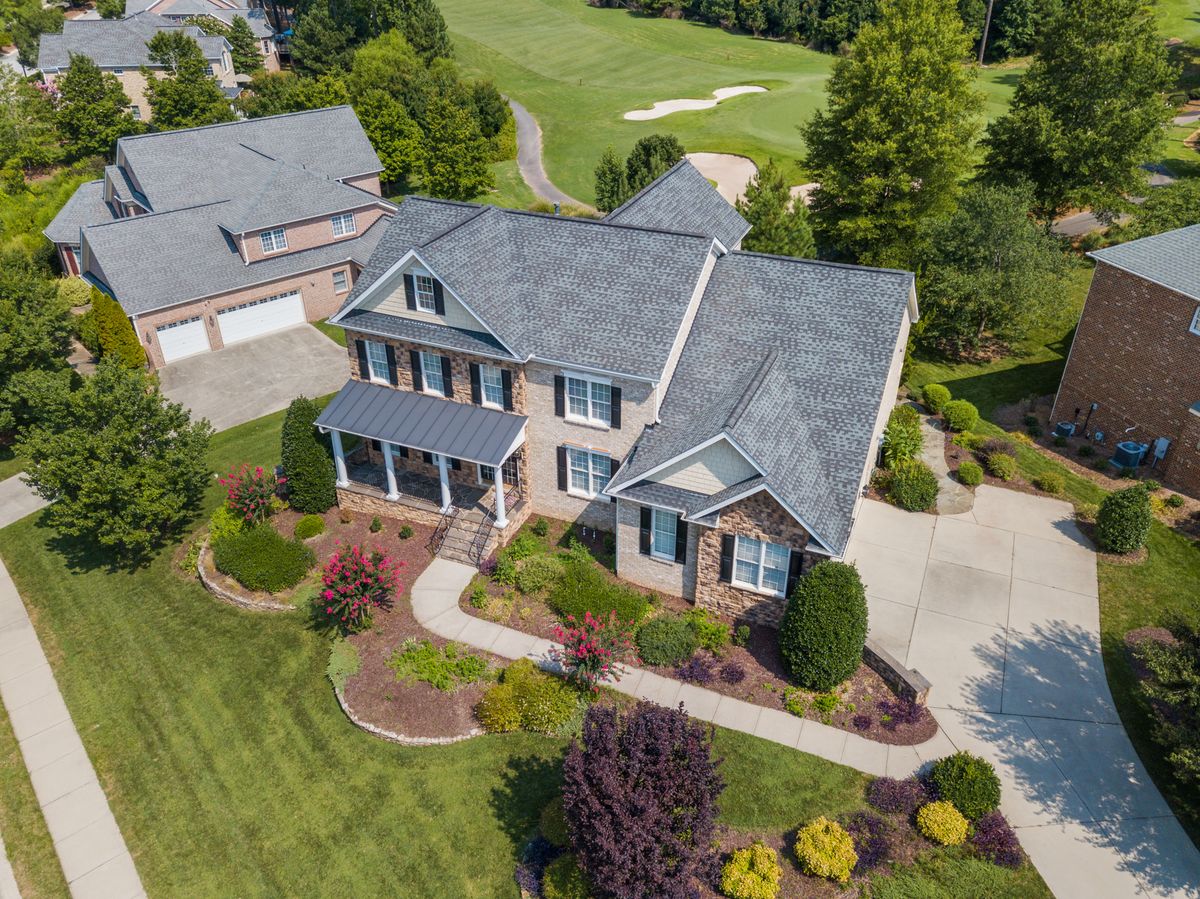 8 Towns To Watch Out For Arizona’s Housing Market Pressure Skyrockets. 1 Bird's-eye view of a beautiful suburban home in Raleigh, NC, with lush landscaping.