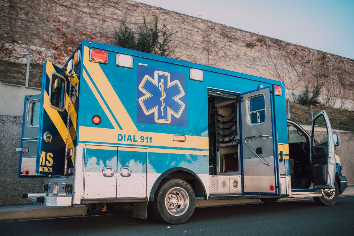 America’s Emergency Readiness Website Is Urging Families to Prepare Now as Disasters Become More Frequent 1 Blue ambulance parked on roadside with open doors, emergency medical service vehicle.