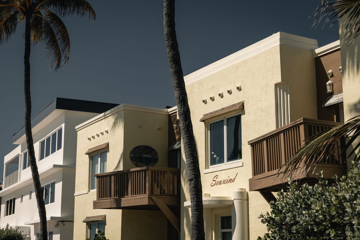 Charming seaside apartments under palm trees in Hollywood, Florida.