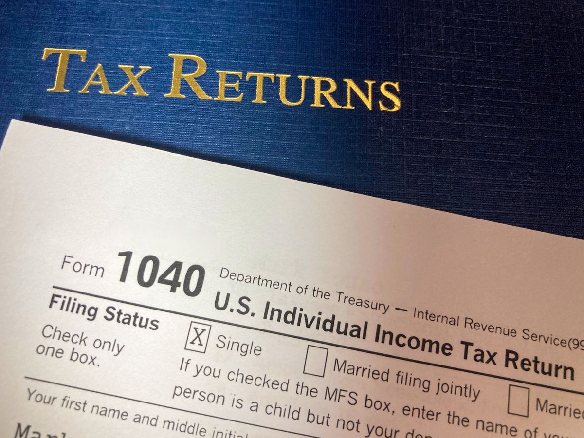 Trump IRS Audit Immunity Under Scrutiny as Former Officials Challenge Settlement Deal 5 Close-up image of Form 1040 for U.S. tax returns, highlighting filing status options.