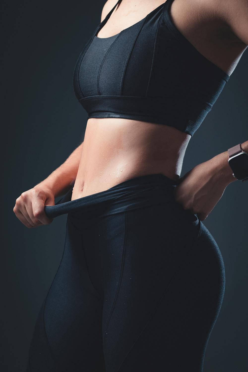 Close-up of a fit woman in sportswear showcasing active lifestyle and fitness.