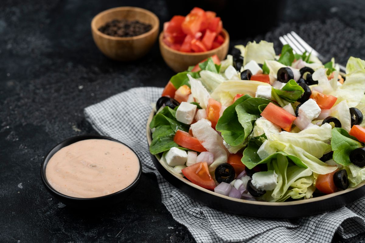 Delicious Greek salad with fresh vegetables, feta cheese, and black olives.