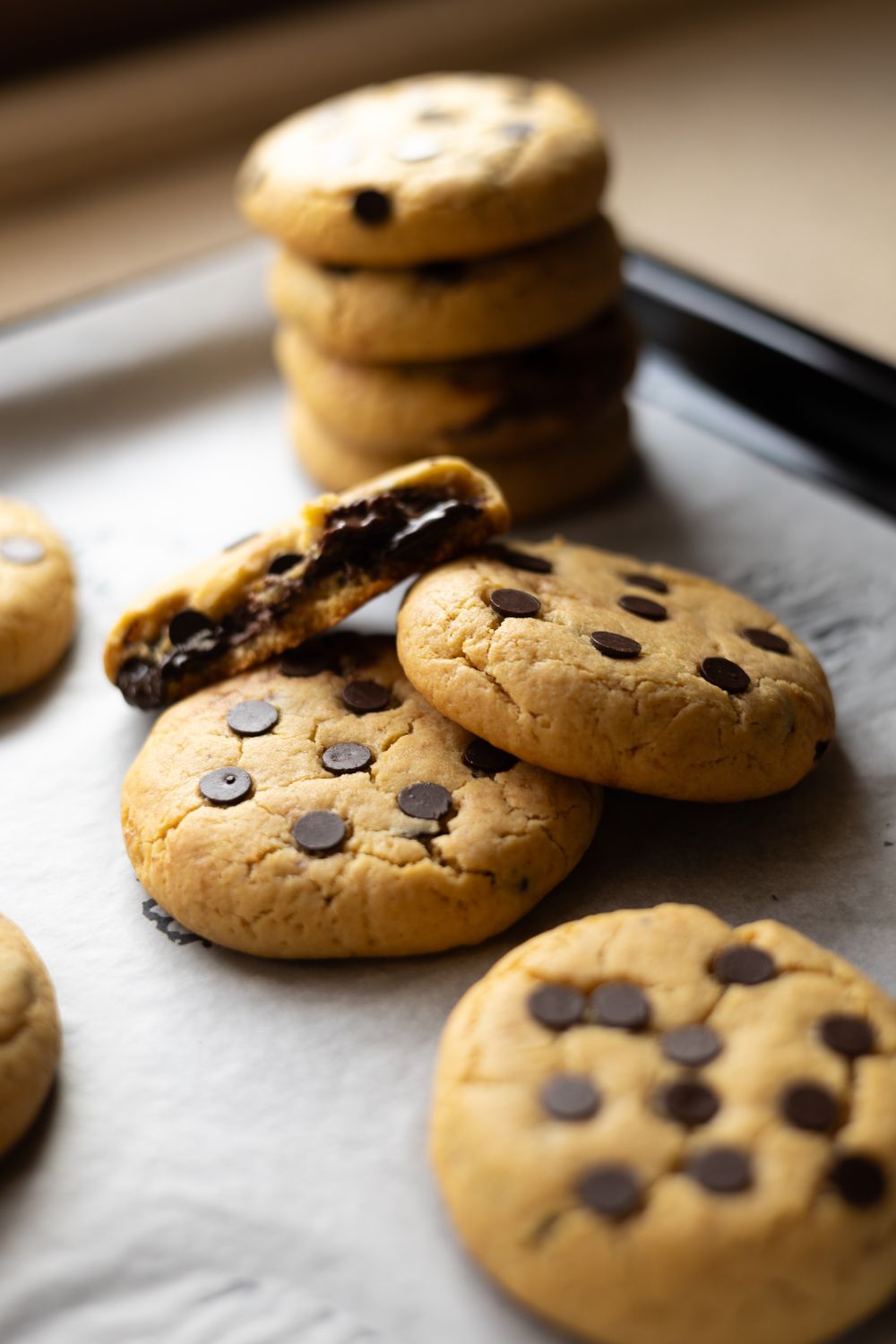 9 Family Recipes Worth Passing Down 2 Delicious homemade chocolate chip cookies fresh from the oven on a baking tray.