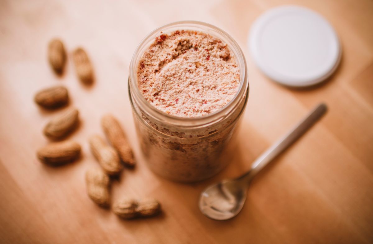 A Peanut Allergy Scare at a Mountain View Pediatric Urgent Care Shows How Fast a Normal Night Can Turn Serious 2 Delicious homemade peanut butter in a glass jar with peanuts and a spoon nearby.