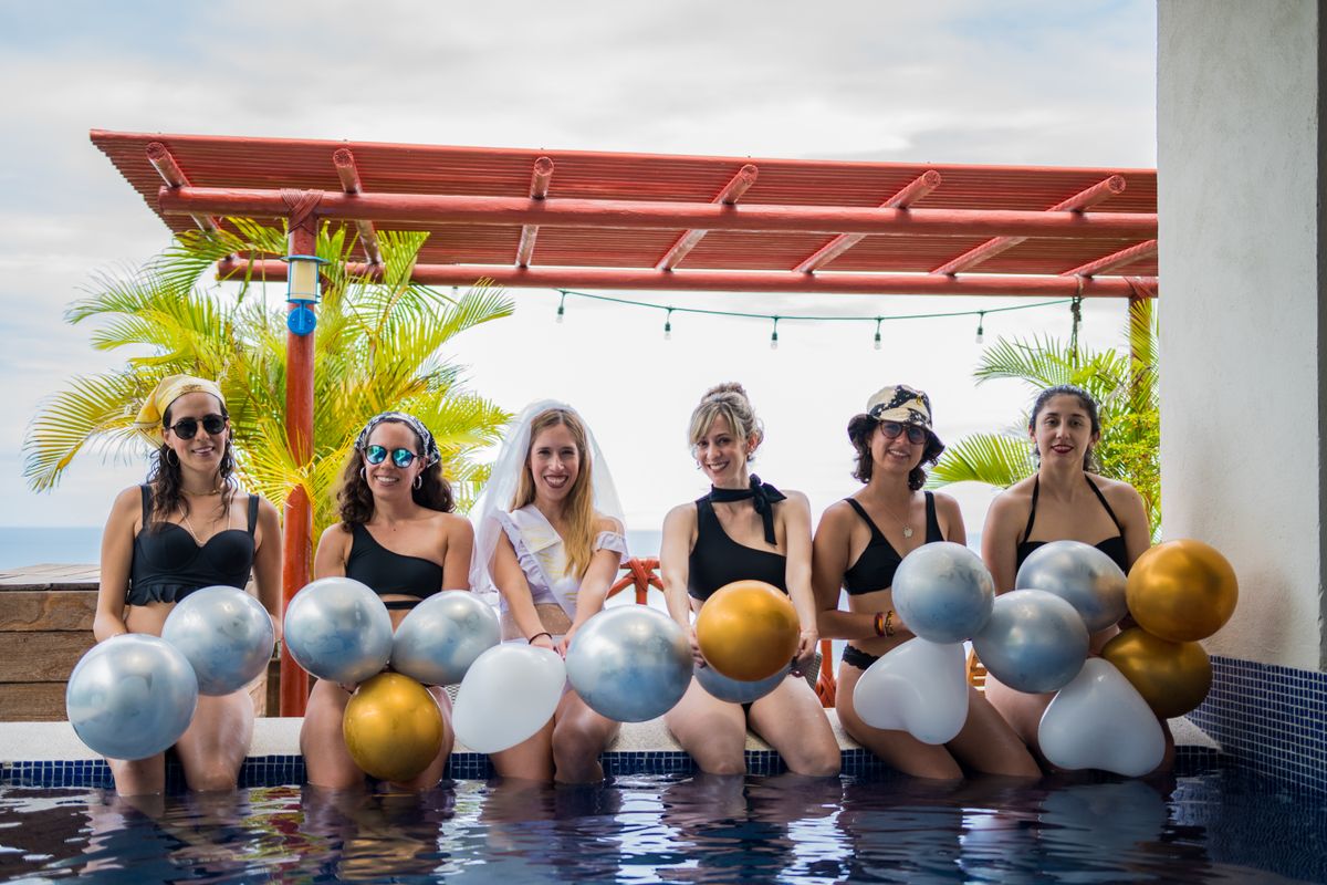 8 States With More Women Than Men in the U.S., According to Census Bureau 1 Group of women celebrating a bachelorette party outdoors with balloons by the pool.