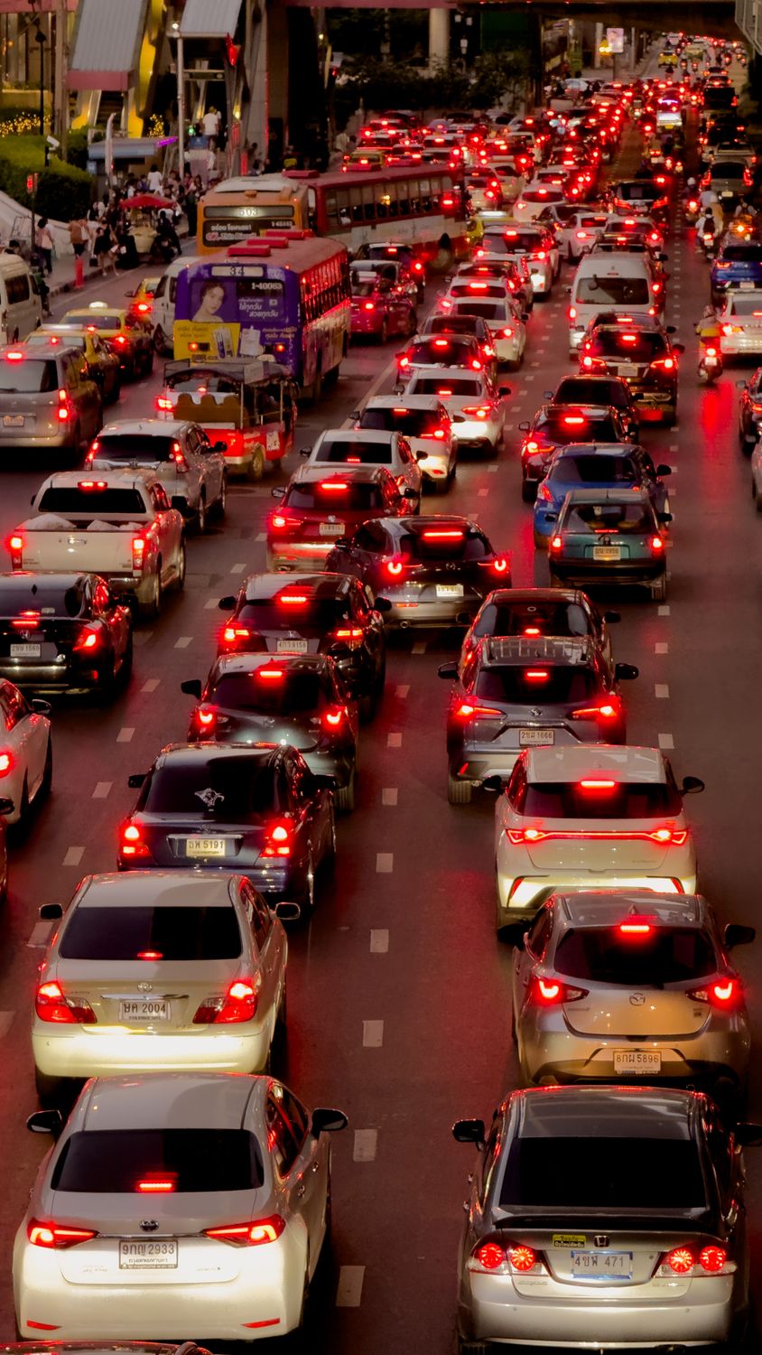America Is Losing More Than Time in Traffic, and the New INRIX Scorecard Shows How Bad It Has Become 1 Heavy traffic jam in downtown Bangkok at twilight with numerous cars
