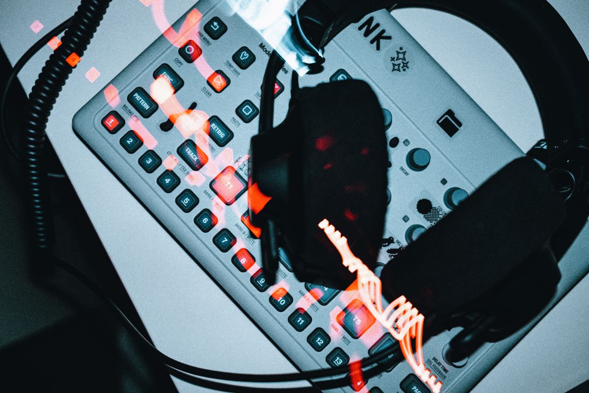 Scientists Found Something Creepy Your Brain Does Under Anesthesia 3 High-angle view of a groovebox with headphones, showcasing modern electronic music production.
