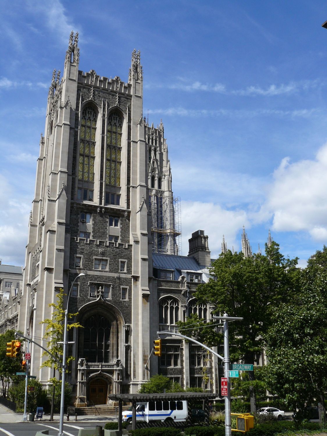Historic Gothic building in New York, showcasing architectural details under a blue sky.