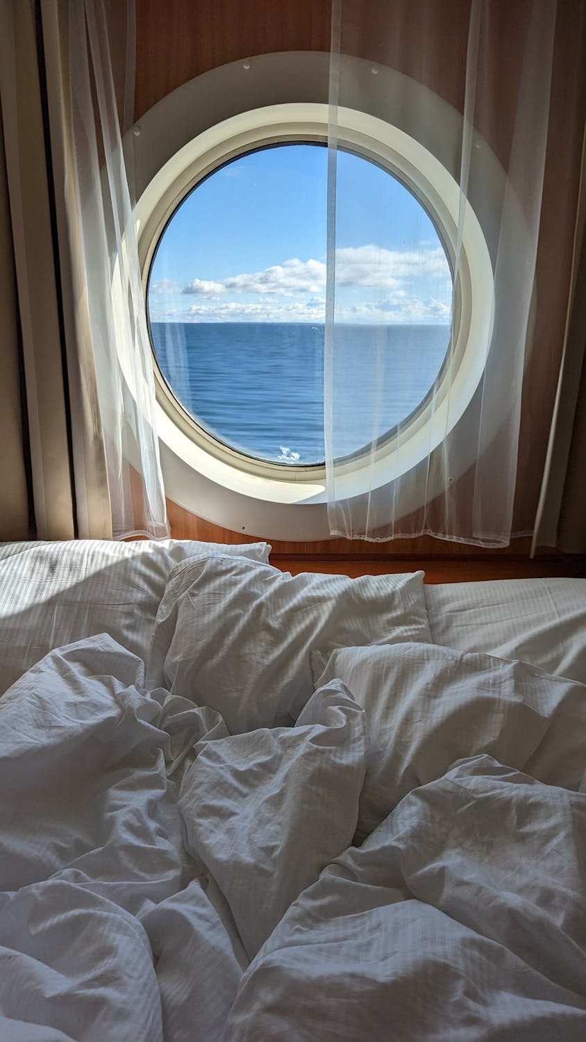 Luxurious cruise ship cabin with sea view. Relaxing ambiance for perfect getaway.