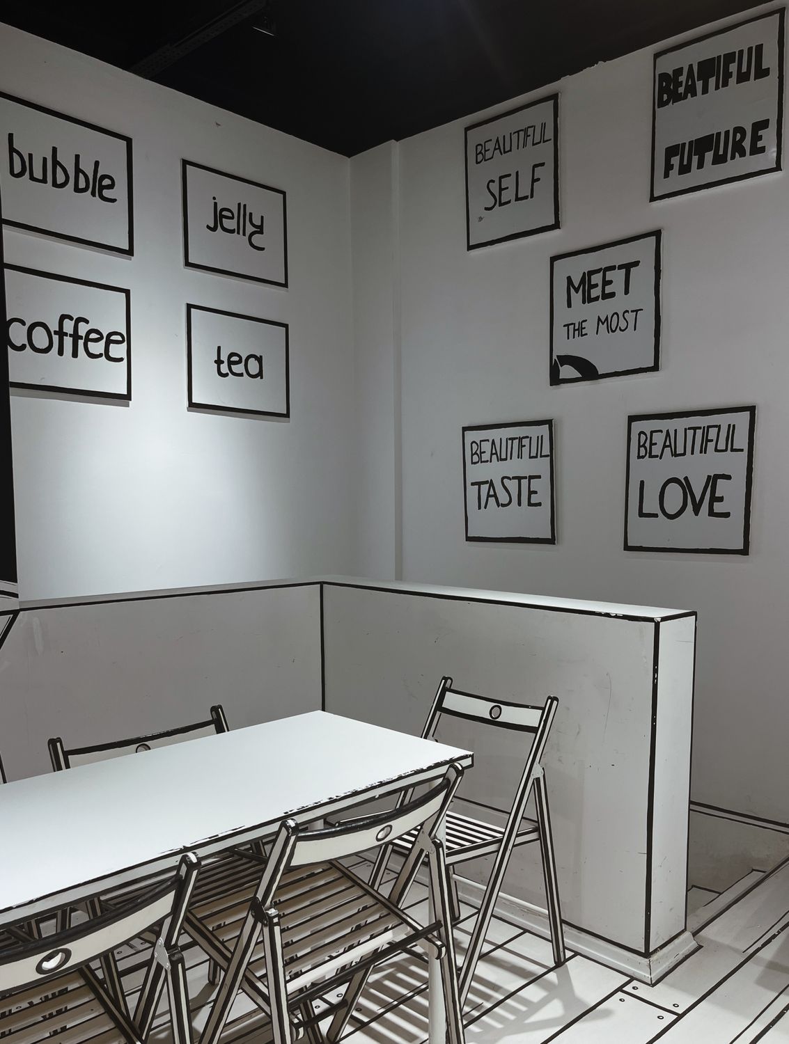 Modern café featuring inspirational wall quotes and minimalist decor.