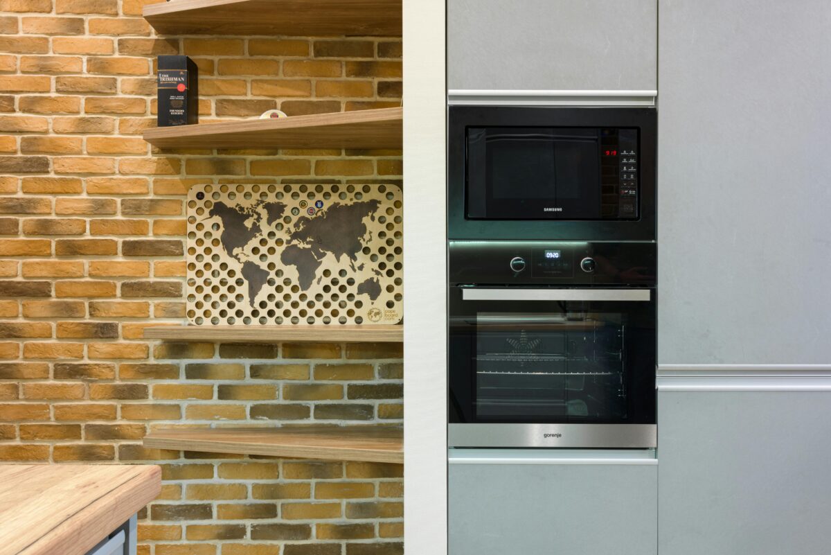 shelves-an-oven-and-a-microwave-in-a-kitchen