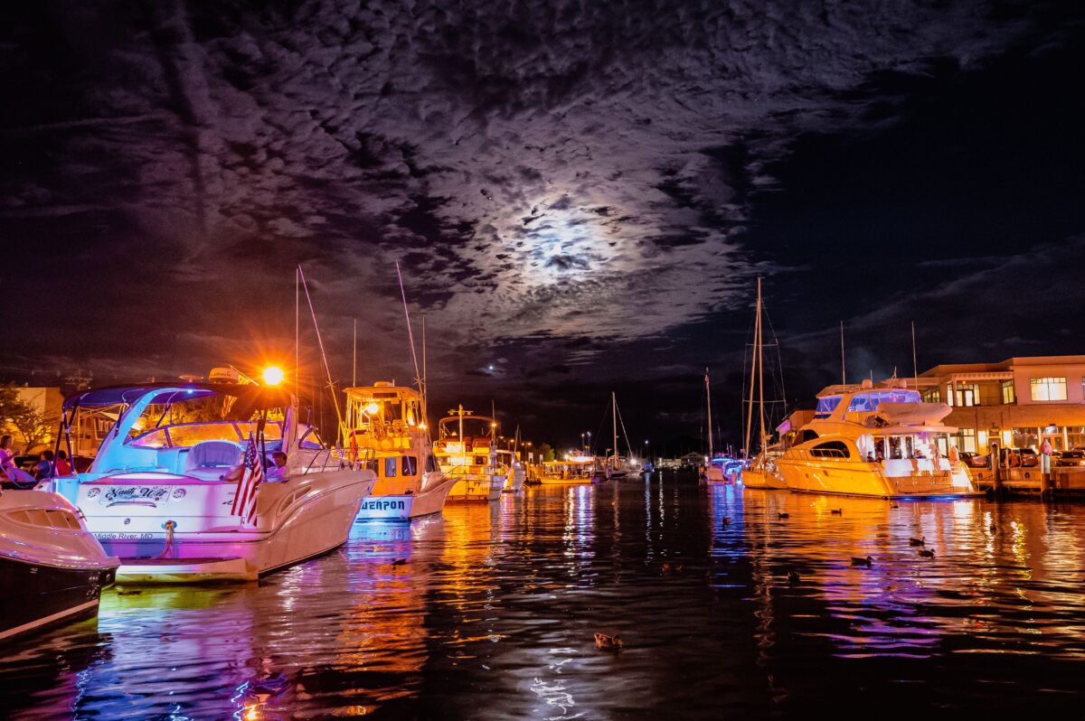 boats-on-body-of-water-under-dark-sky