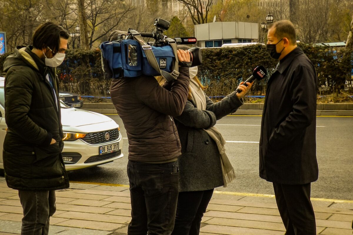 a-journalist-interviewing-a-man-in-a-city