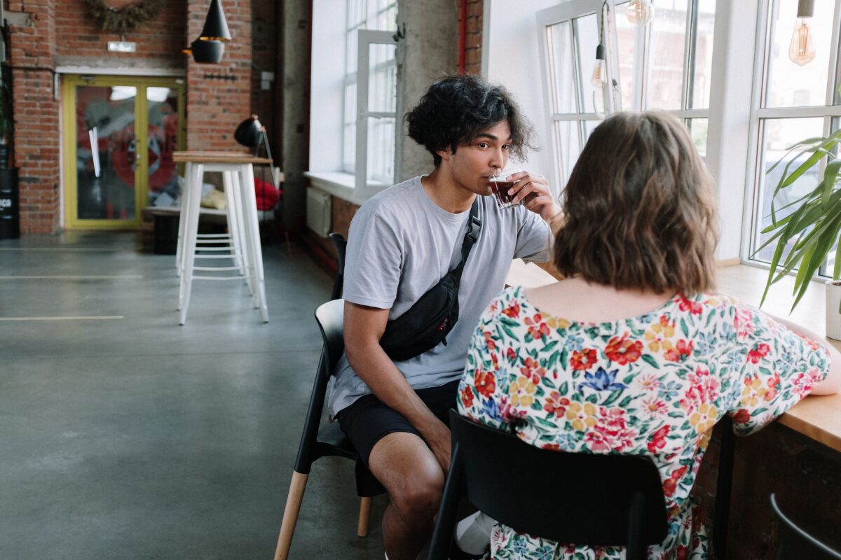 Young adults enjoy a relaxed conversation in a quiet place