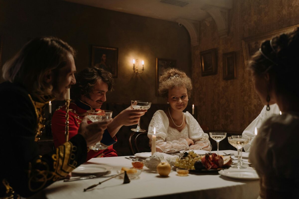men-and-women-sitting-at-a-table-drinking-wine