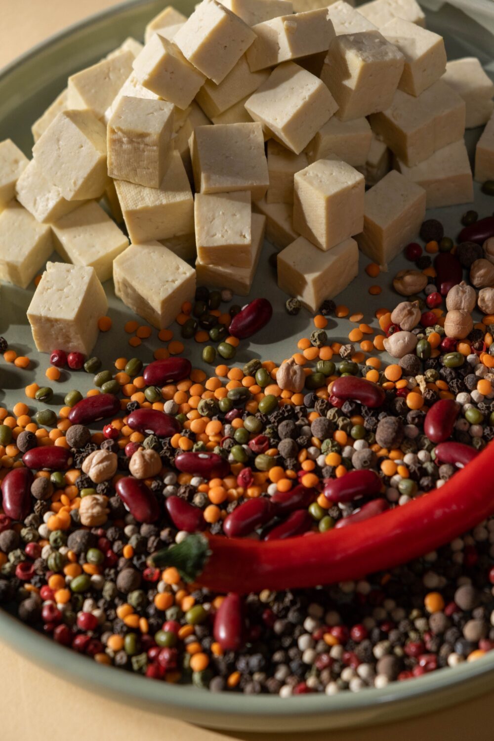 tofu-cubes-by-seeds-and-chili-pepper-on-plate