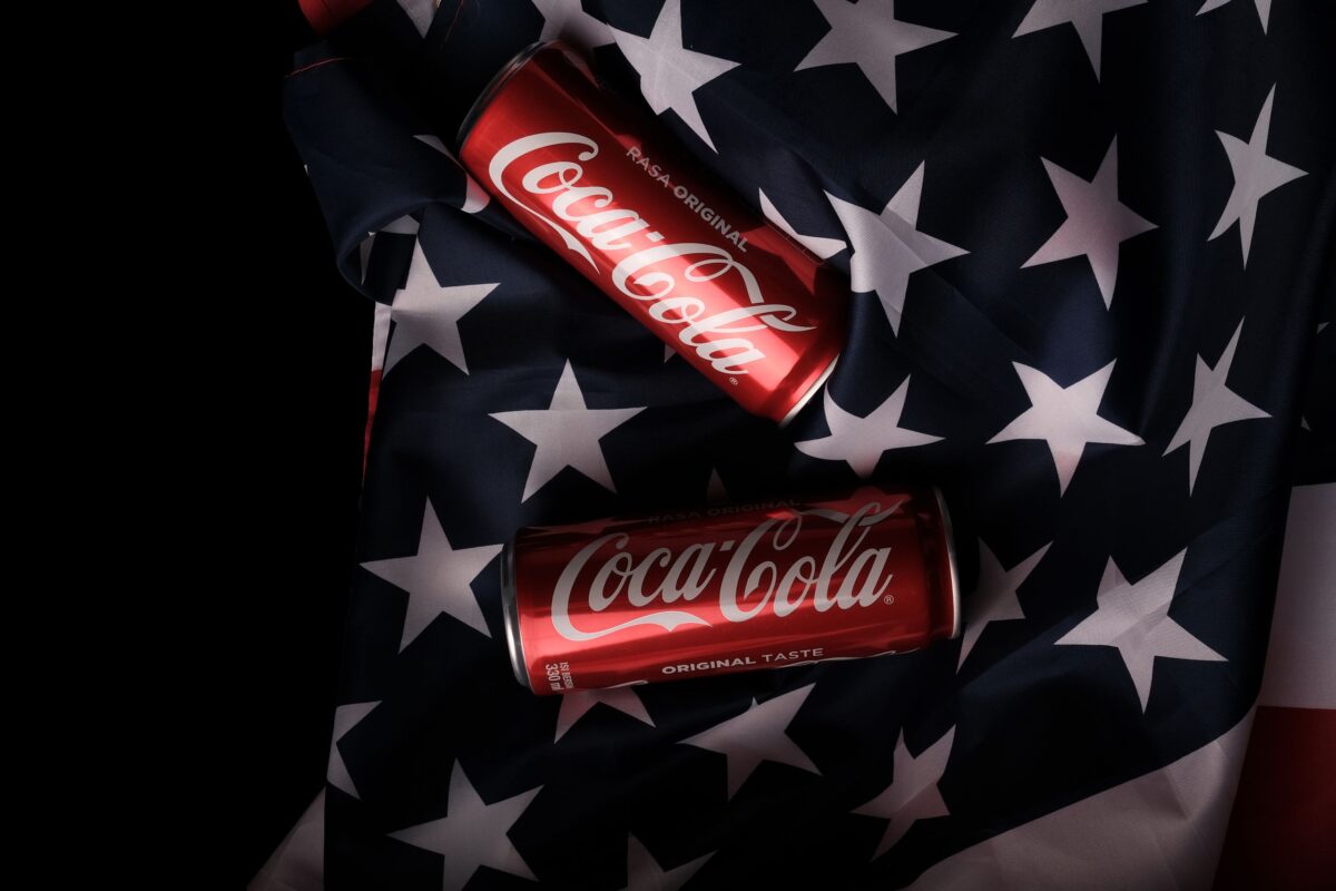 How Shoppers Are Trading Down Without Even Realizing It as Store Brands Quietly Redefine the American Grocery Aisle. 3 red-cans-on-a-flag