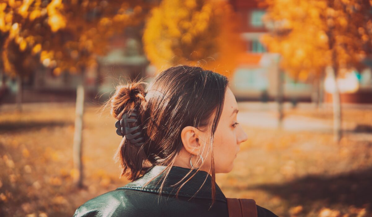 woman-in-black-leather-jacket-looking-over-shoulder