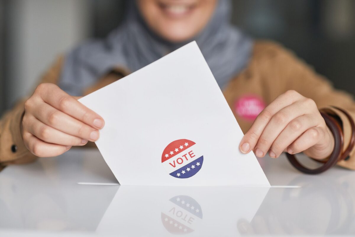 a-woman-dropping-her-vote-in-a-box