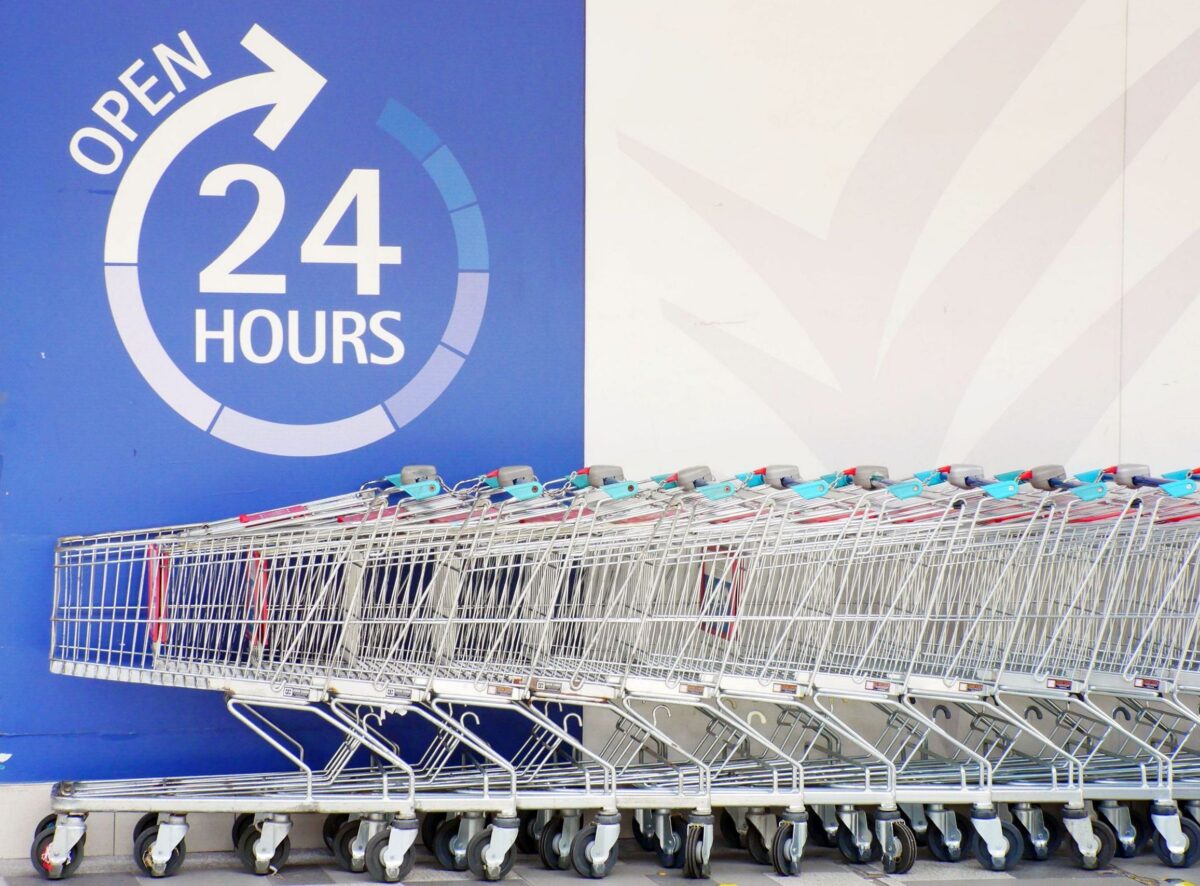 Walmart and the 2026 Consumer Shift: How America’s Largest Retailer Is Navigating a Smarter, Faster, More Demanding Shopper. 3 shopping-carts-lined-up-outside-24-hour-supermarket