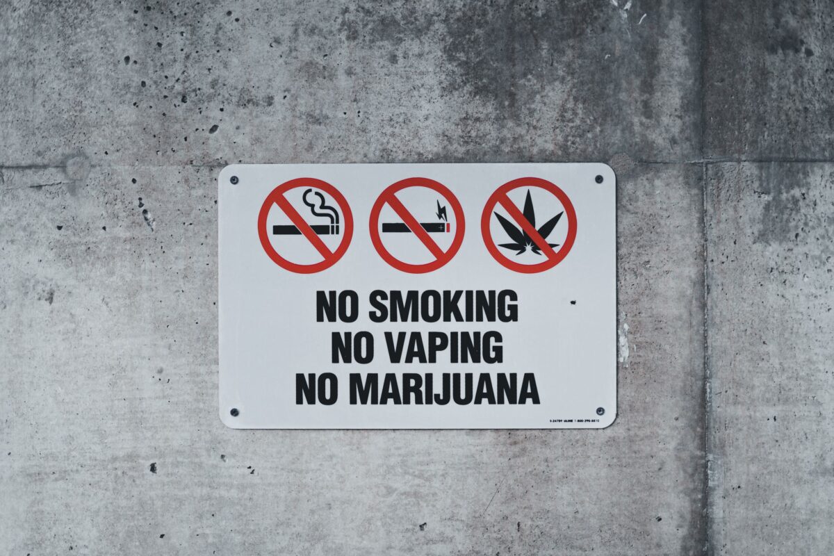 Texas Marijuana Gun Case Exposes a Legal Contradiction That America Still Hasn’t Resolved. 3 a-sign-forbidding-smoking-attached-to-a-wall