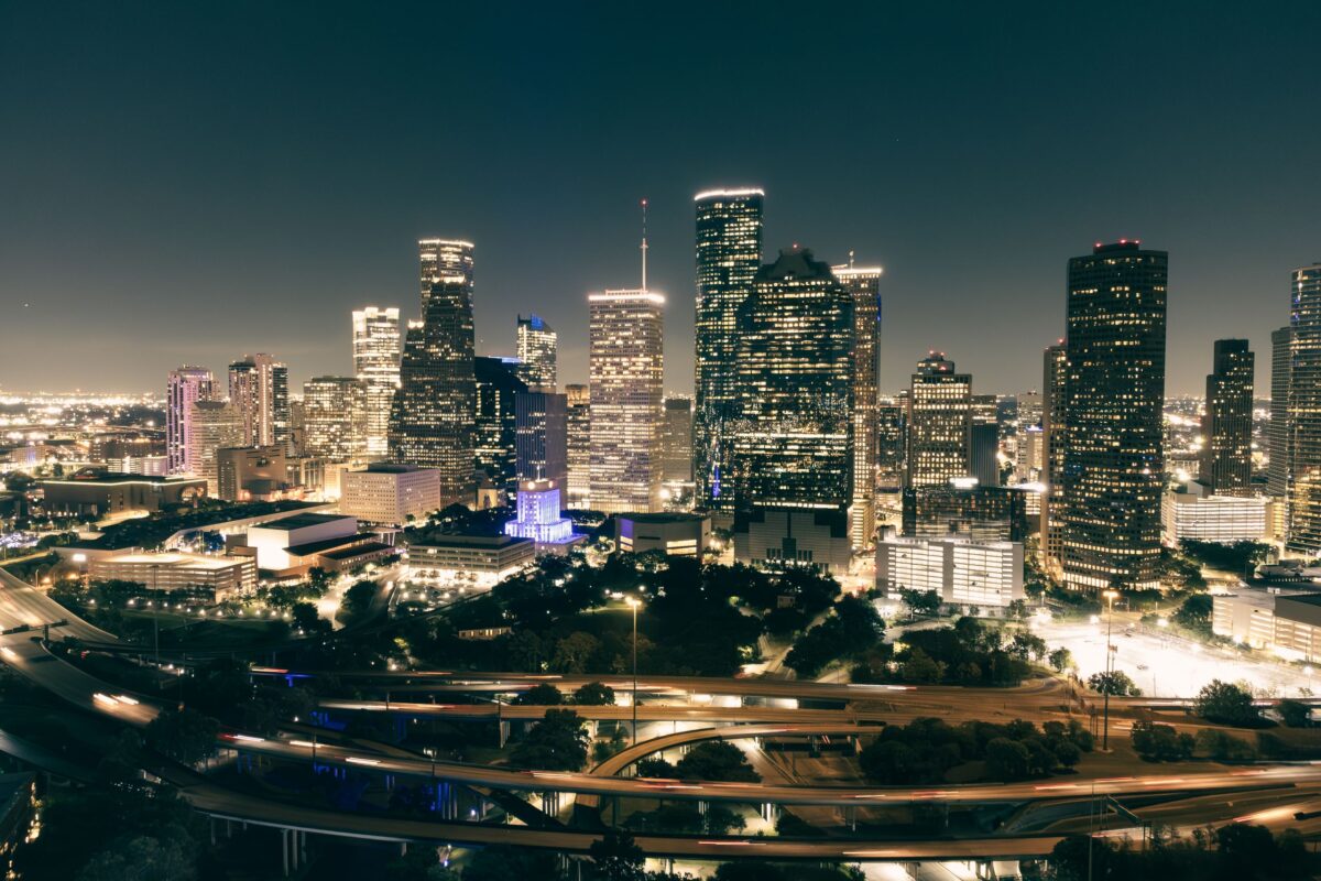 illuminated-skyscrapers-and-roads-in-city-downtown-at-night