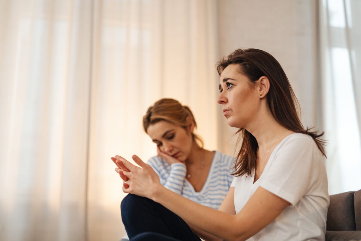 8 Sad Ways Being Online Is Ruining Real-Life Friendships 5 two-women-sitting-in-a-room