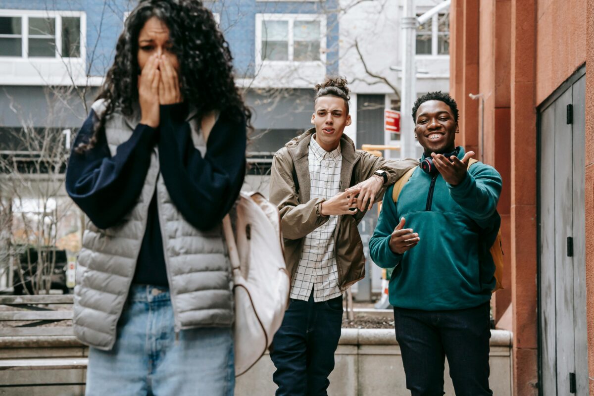 8 Ways Why Some Heartbreaks Hurt More Than Others 2 young-diverse-men-harassing-female-on-street