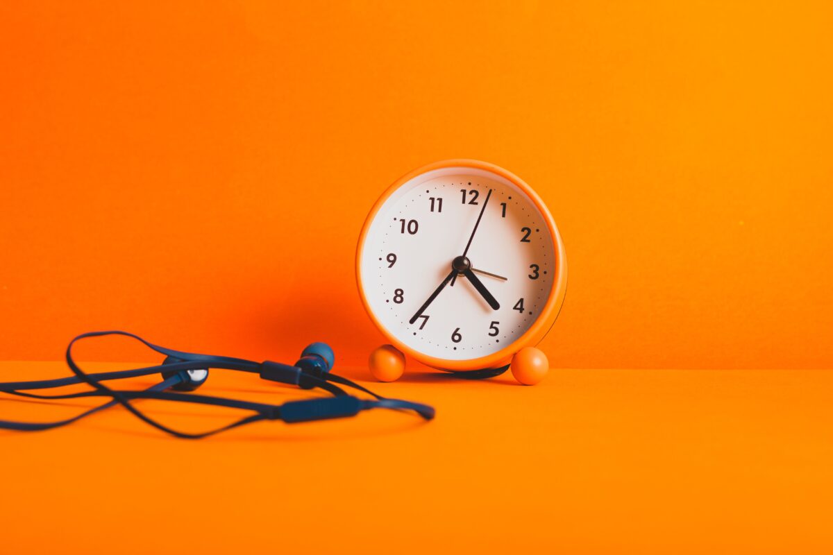 orange-alarm-clock-on-orange-surface