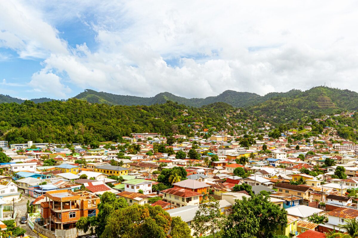 aerial-view-of-houses-near-green-mountains