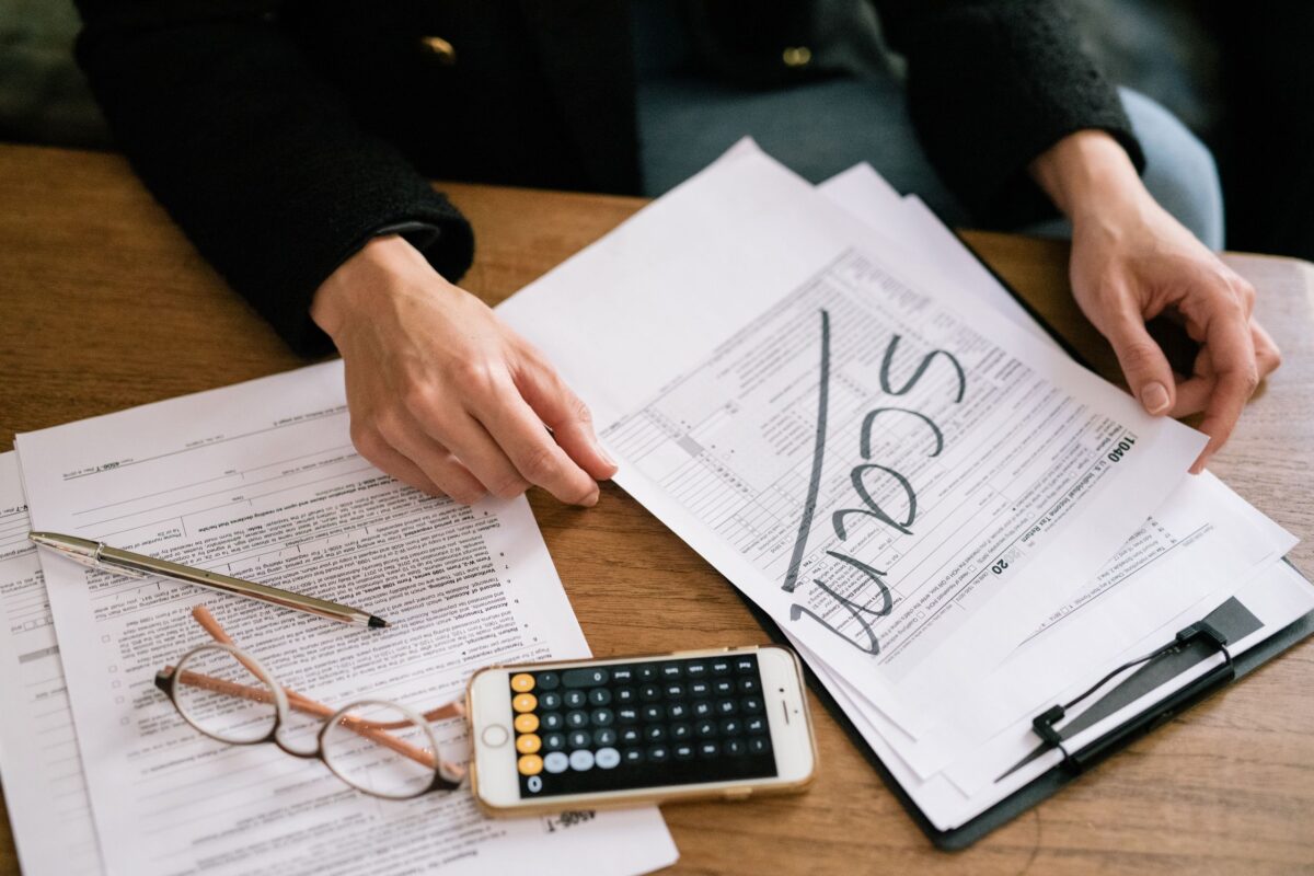 a-person-holding-a-tax-form