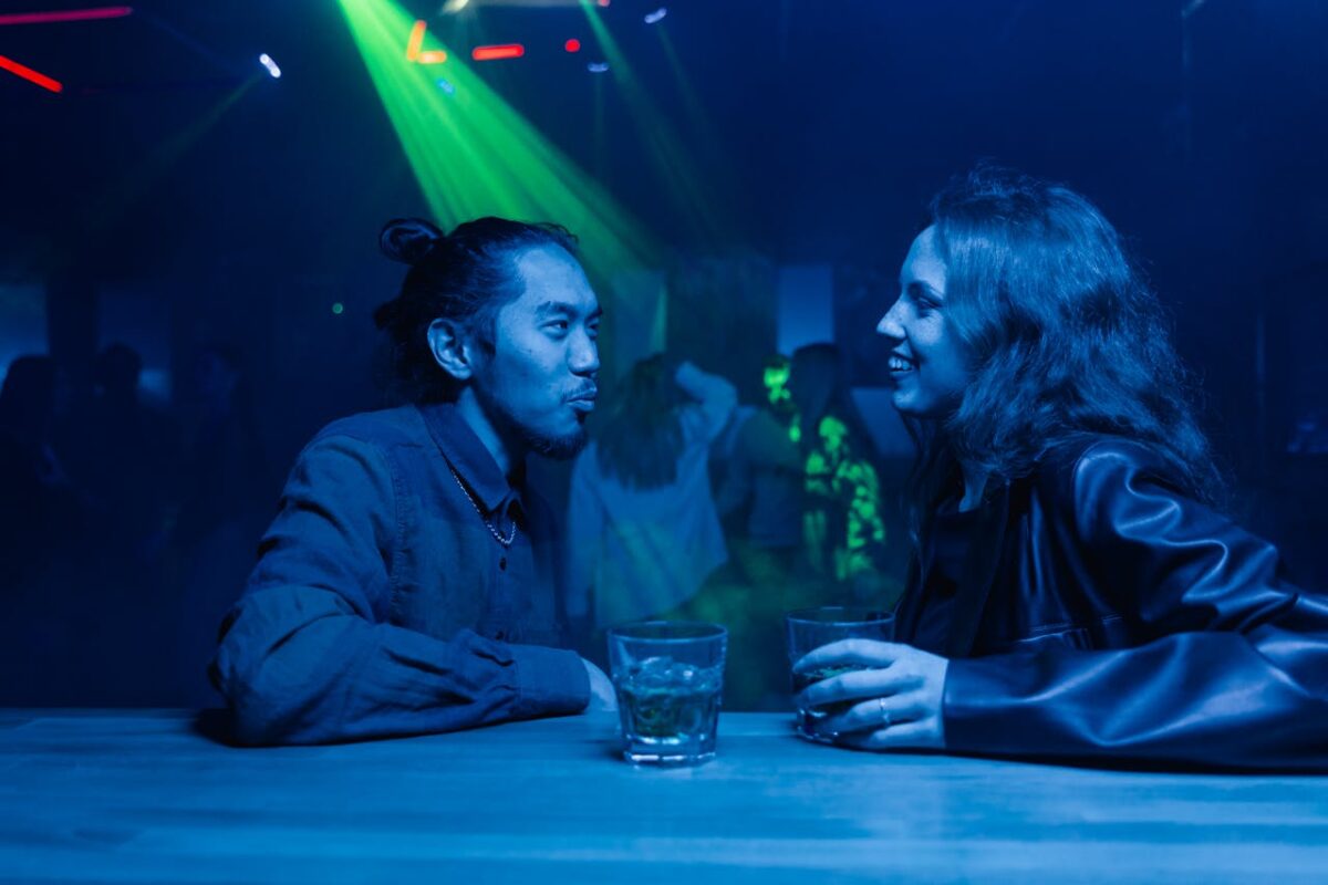 photo-of-a-man-talking-to-a-woman-in-a-leather-jacket-