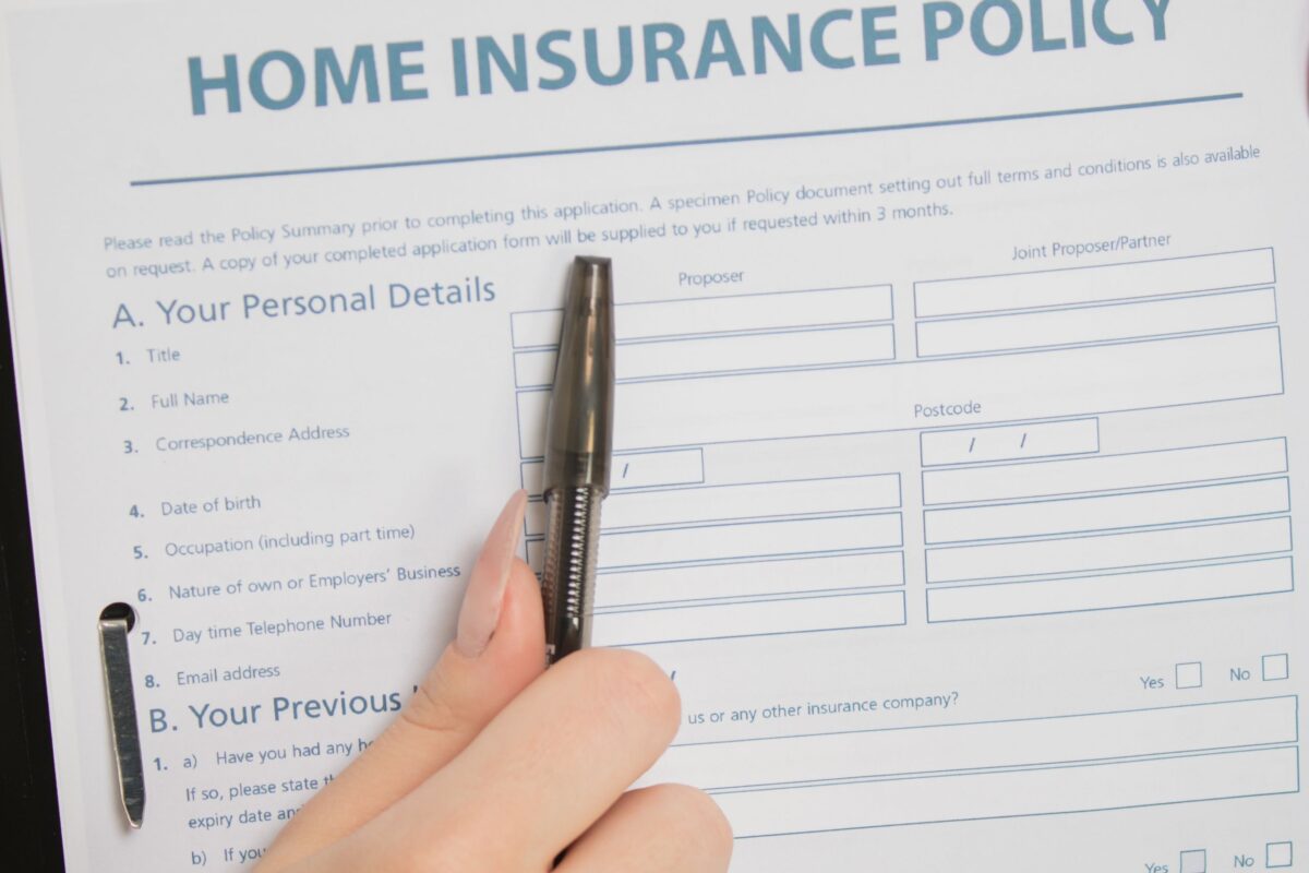 person-holding-home-insurance-policy
