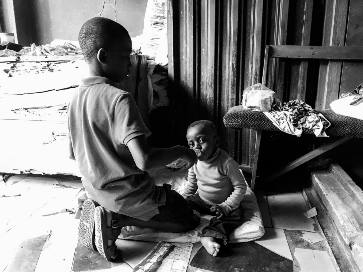 black-and-white-photo-of-children-indoors-feeding