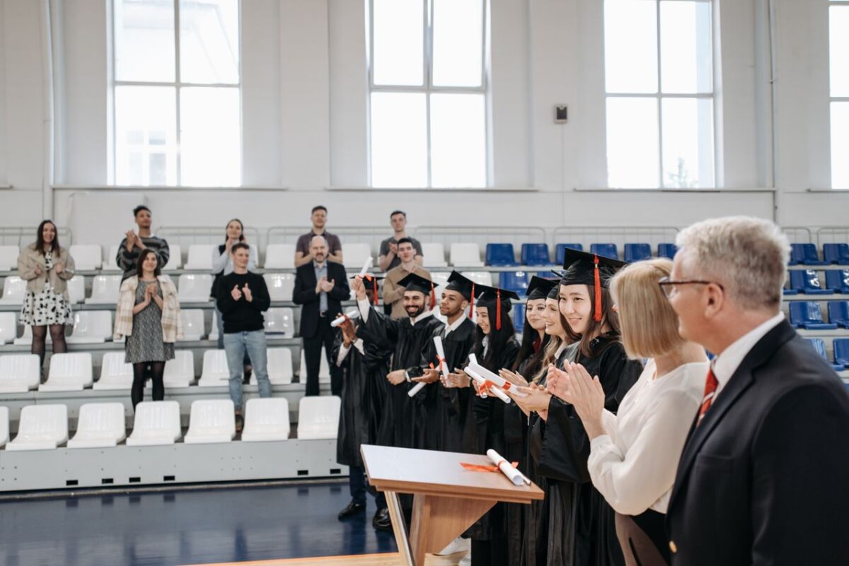 /photo-of-people-gathered-inside-gymnasium-