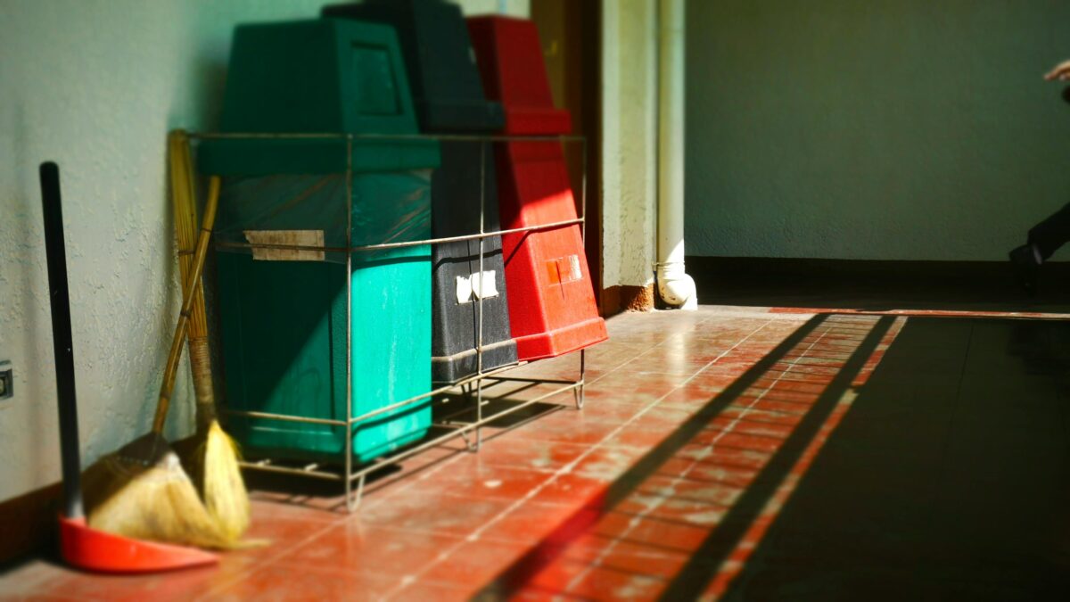 colorful-recycling-bins-in-sunlit-corridor