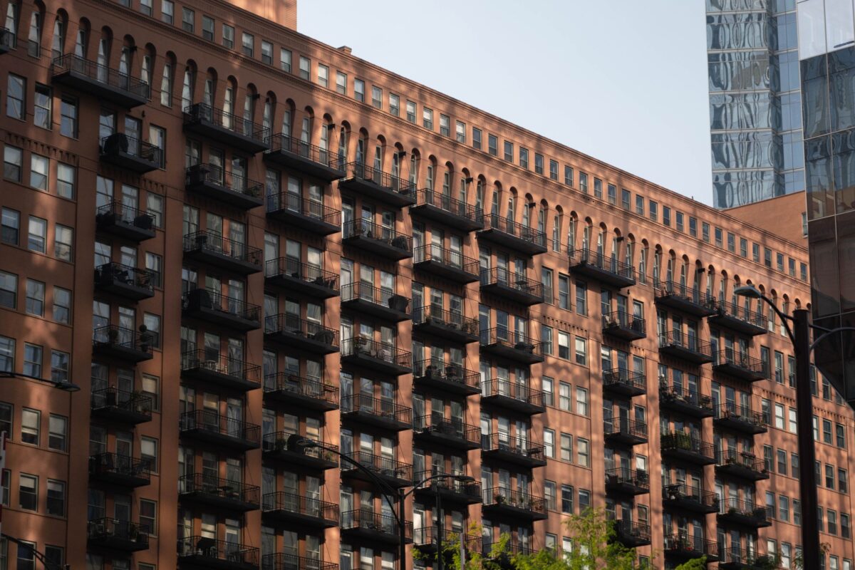 America’s Rent Relief Is Not Reaching Everyone as These Cities Get Hit With Painful 2026 Increases 3 a-tall-building-with-many-windows-and-balconies