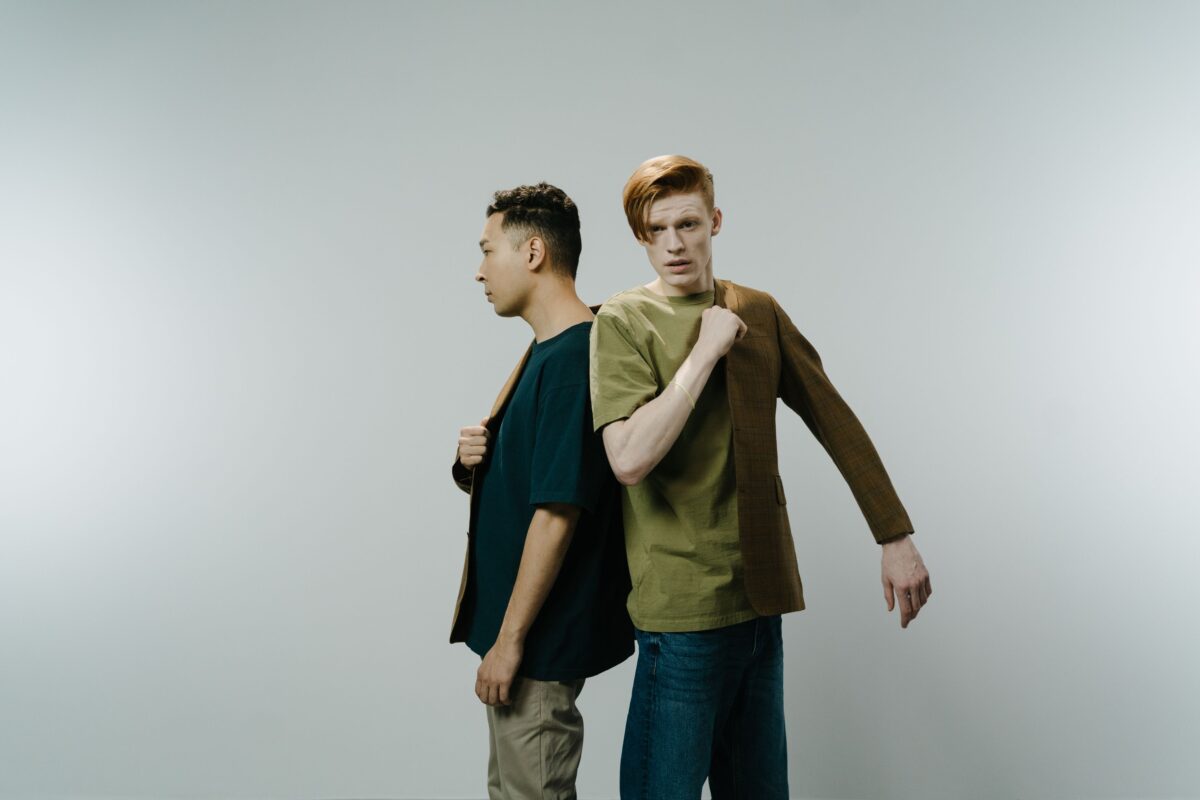 8 Reasons Friendship Burnout Is Becoming More Common Among Adults 3 men-sharing-a-single-brown-blazer