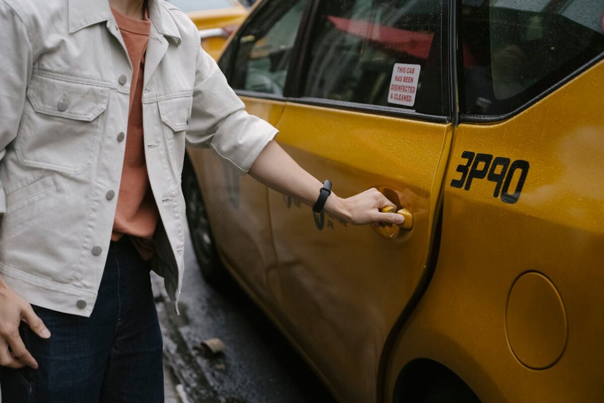 10 Things You Should Never Do When Someone Is Following You 4 crop-person-opening-yellow-taxi-
