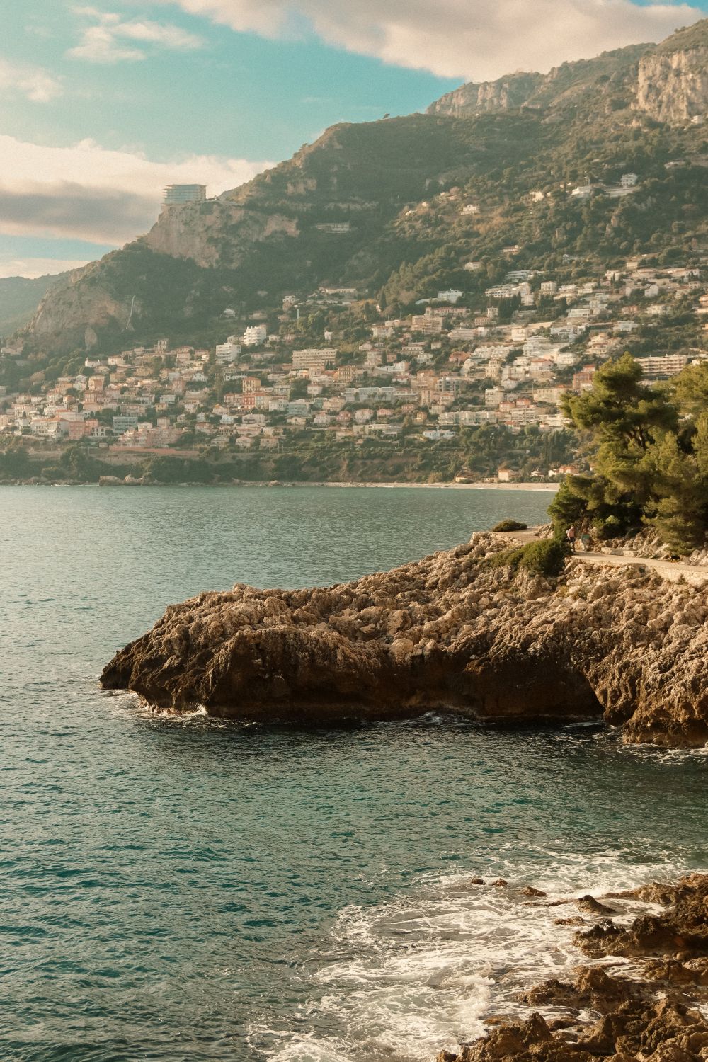 7 Hidden Dangers Along Europe’s Coasts Experts Say Could Unleash a Killer Wave 2 Picturesque coastal town featuring rocky shoreline and hillside village.