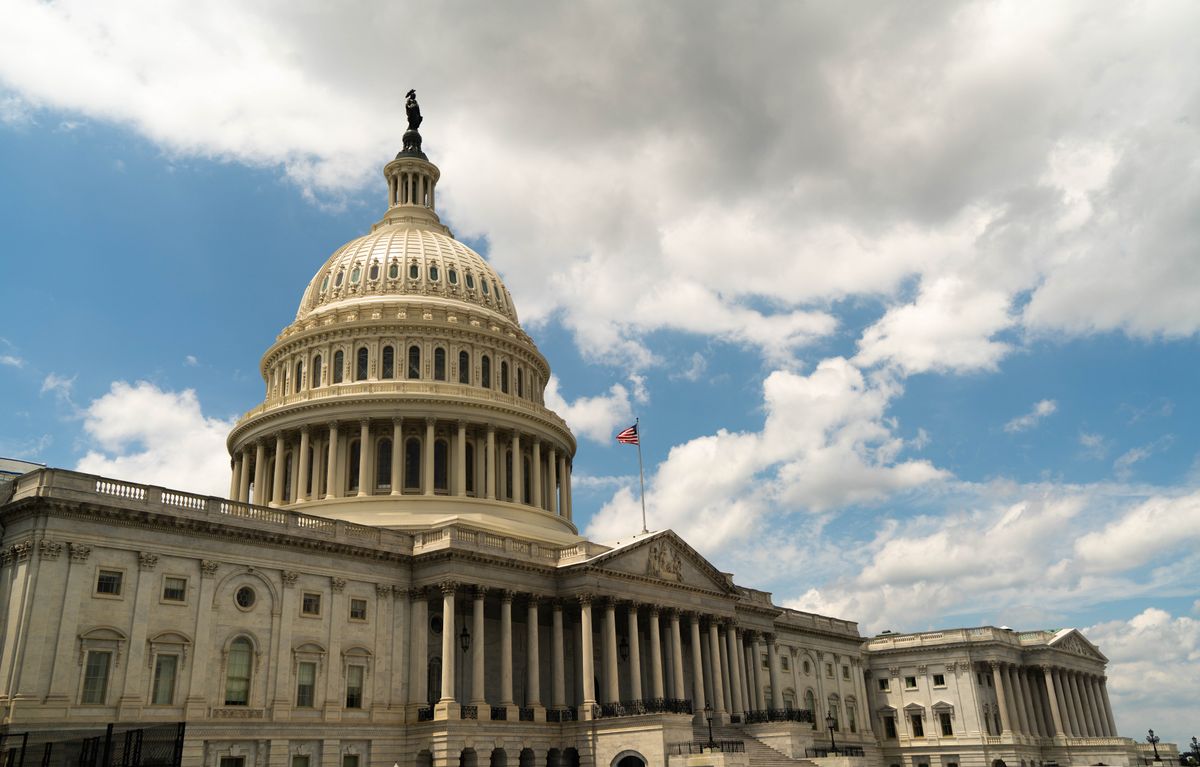 Trump IRS Audit Immunity Under Scrutiny as Former Officials Challenge Settlement Deal 4 The United States Capitol building dome against a blue sky in Washington, DC, architectural landmark.